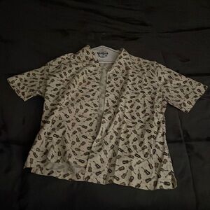 XL shirt from Prints Charming with black and brown acoustic guitars printed.
